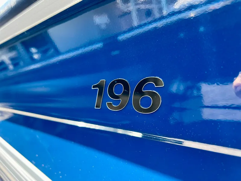 Slide: The Image of 2023 Starcraft Fishmaster 196 boat interior with open storage compartment. - 7