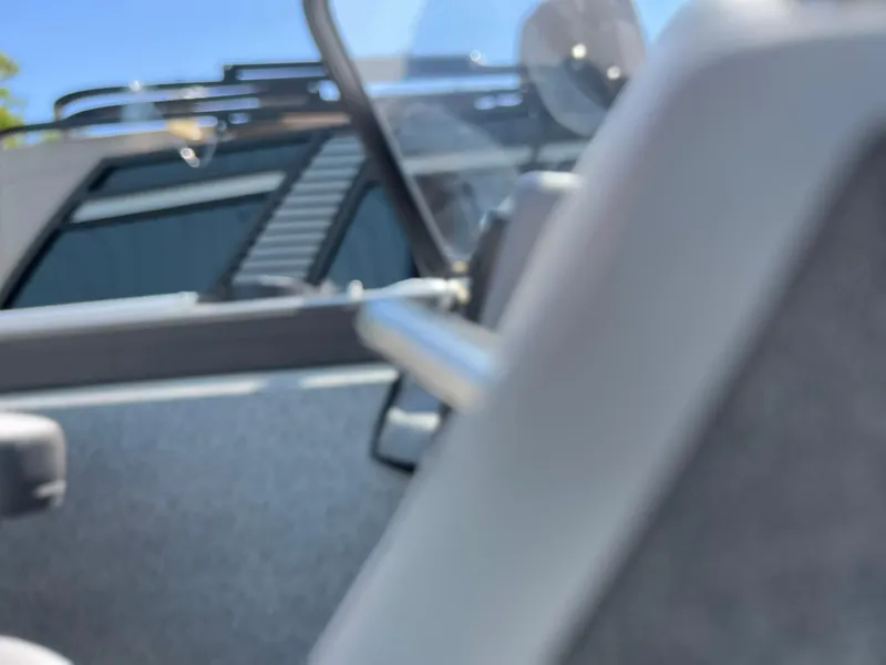 Slide: The Image of 2023 Starcraft Fishmaster 196 boat interior with dashboard and storage compartments. - 8