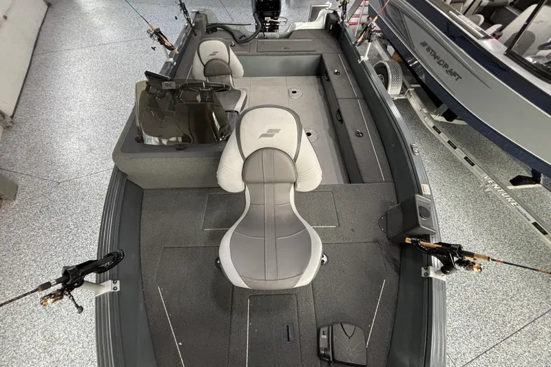 Slide: The Image of 2023 Starcraft Storm 166 SC fishing boat interior with seating and rod holders. - 18