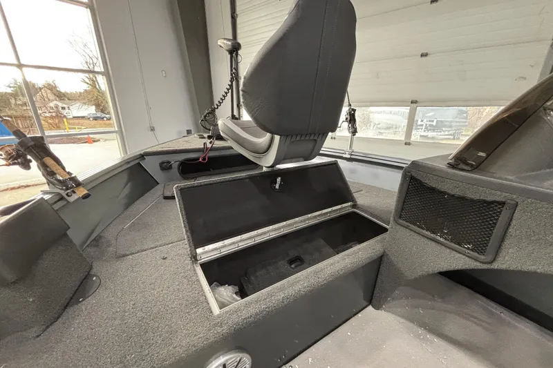 Slide: The Image of 2023 Starcraft Storm 166 SC boat interior with storage compartments and seating. - 19