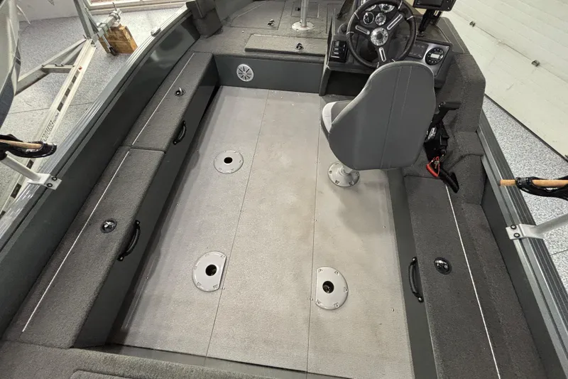Slide: The Image of 2023 Starcraft Storm 166 SC boat interior with seating and storage compartments. - 22
