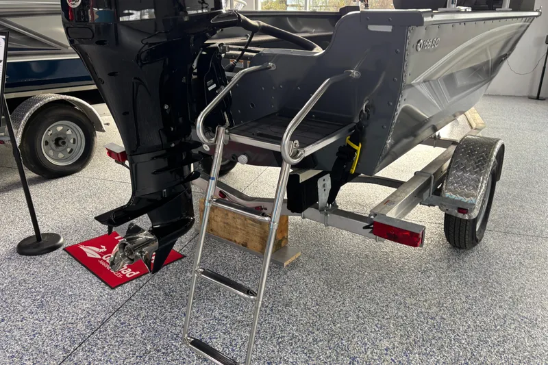 Slide: The Image of 2023 Starcraft Storm 166 SC boat on trailer with motor and ladder. - 24