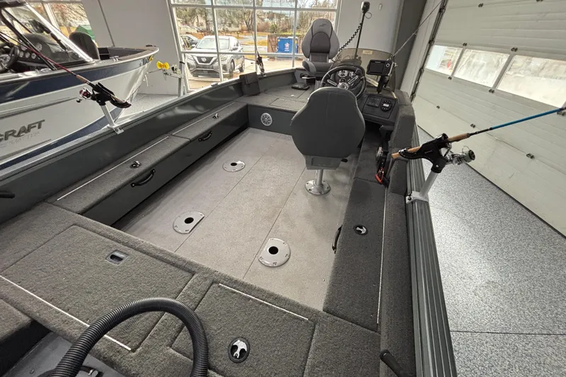 Slide: The Image of 2023 Starcraft Storm 166 SC fishing boat interior with seating and rod holders. - 25