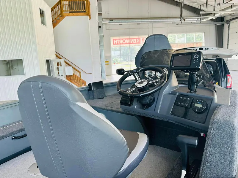Slide: The Image of 2023 Starcraft Storm 166 SC boat interior with steering wheel and navigation system. - 27