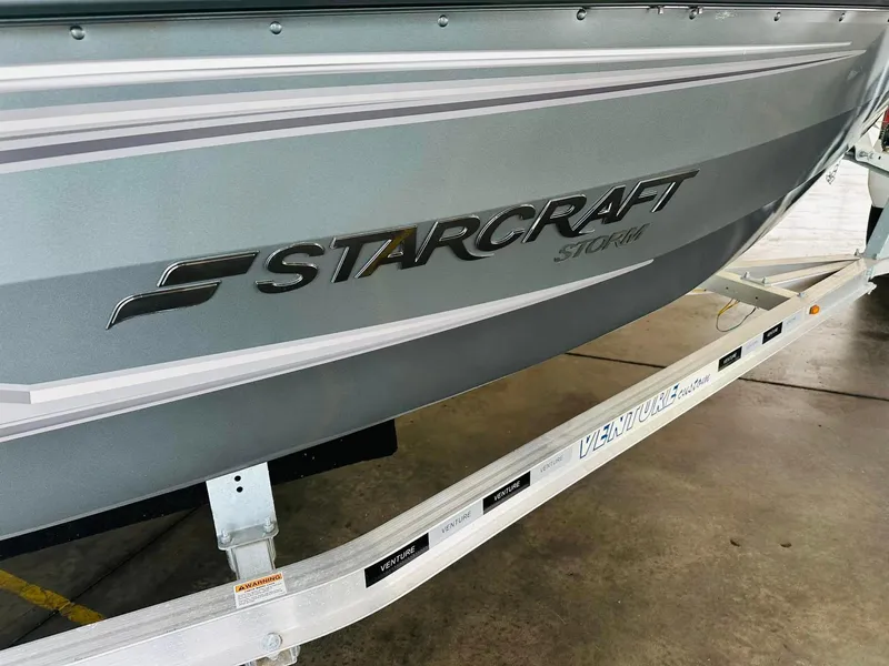Slide: The Image of 2023 Starcraft Storm 166 SC boat on trailer, side view. - 29