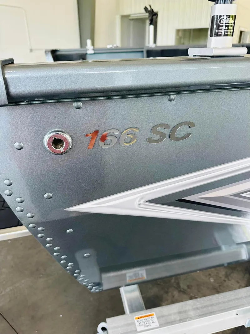 Slide: The Image of 2023 Starcraft Storm 166 SC boat detail, showcasing model name and sleek design. - 30