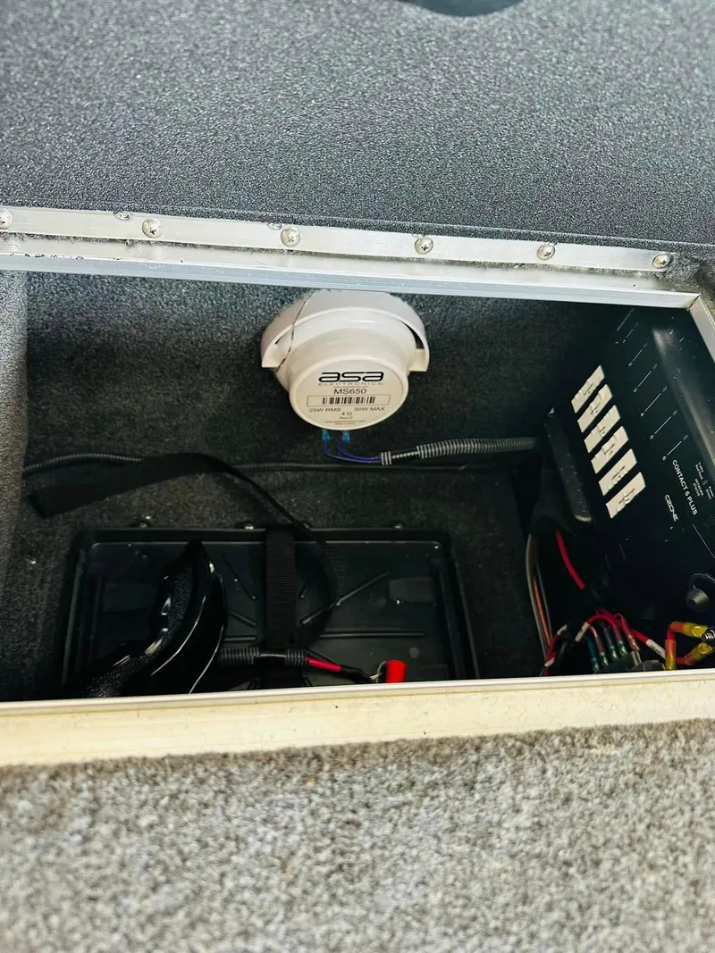 Slide: The Image of 2023 Starcraft Storm 166 SC boat interior compartment with wiring and ASA electronics. - 31