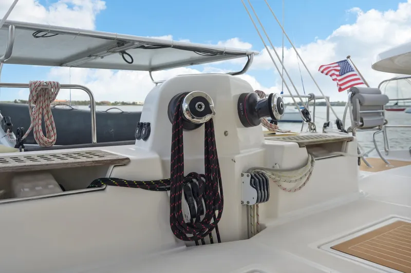Slide: The Image of Catana 42 sailboat deck with winches and American flag, 2016 model. - 11