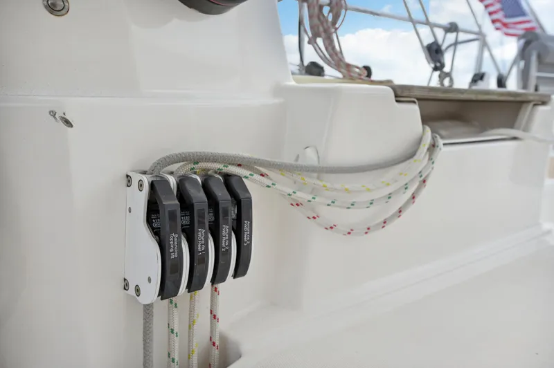 Slide: The Image of Close-up of Catana 42 sailboat rigging system, 2016 model, with ropes and clutches. - 12