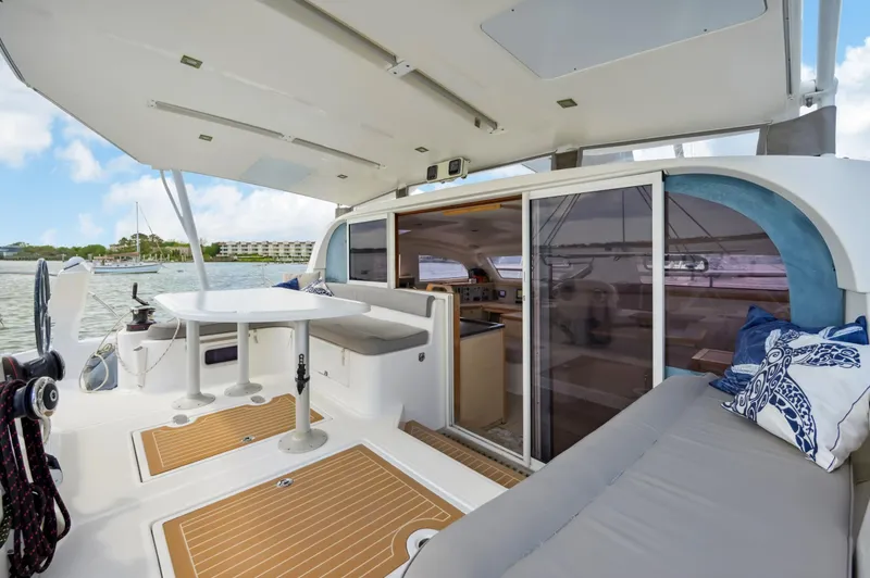Slide: The Image of 2016 Catana 42 catamaran interior with seating, table, and sliding doors. - 21