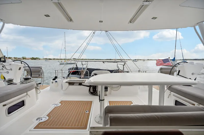 Slide: The Image of Spacious deck of 2016 Catana 42 catamaran with seating and ocean view. - 23