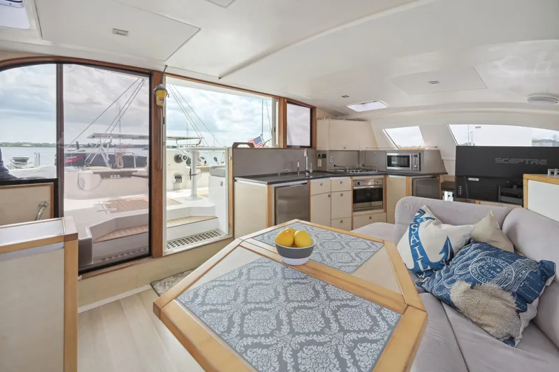 Slide: The Image of Interior of 2016 Catana 42 yacht with modern kitchen and cozy seating area. - 26