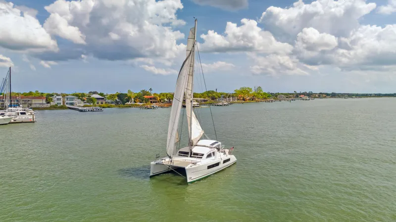 Slide: The Image of Catana 42 catamaran sailing on a calm sea under a partly cloudy sky, 2016 model. - 3