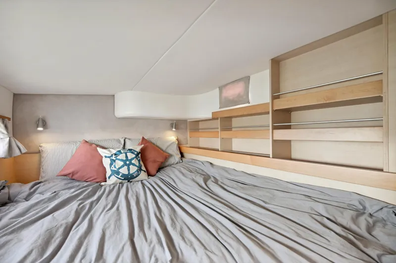 Slide: The Image of Cozy bedroom in 2016 Catana 42 yacht with modern decor and nautical-themed pillows. - 35