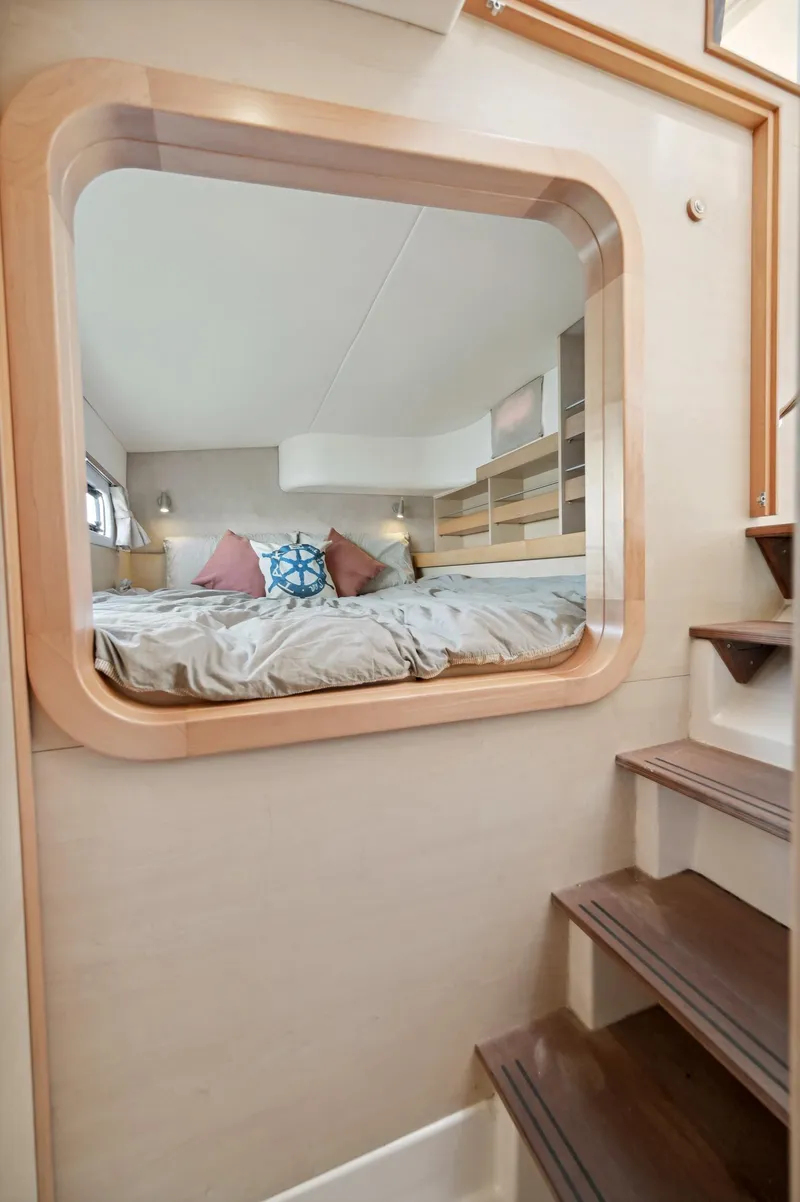 Slide: The Image of Interior of 2016 Catana 42 yacht with cozy bedroom and wooden stairs. - 38