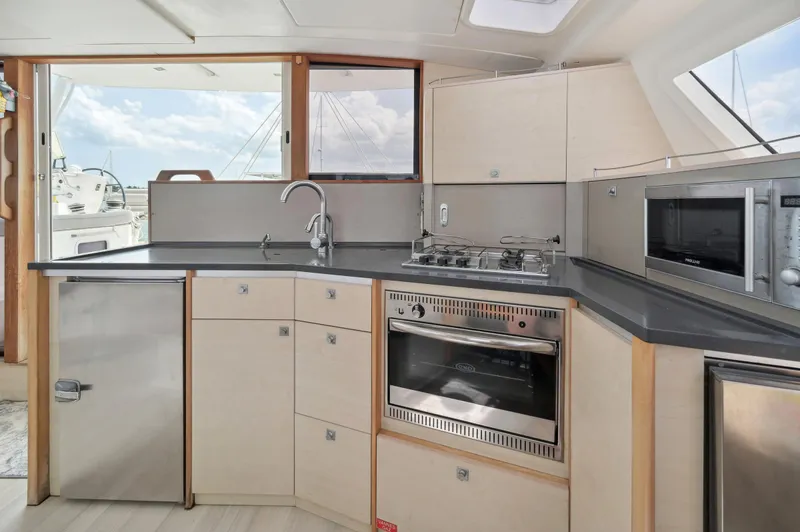 Slide: The Image of Modern kitchen interior of 2016 Catana 42 yacht with stainless steel appliances. - 43
