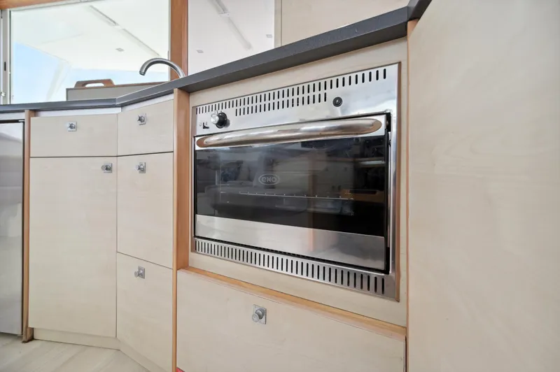 Slide: The Image of Modern kitchen oven in 2016 Catana 42 yacht interior. - 46