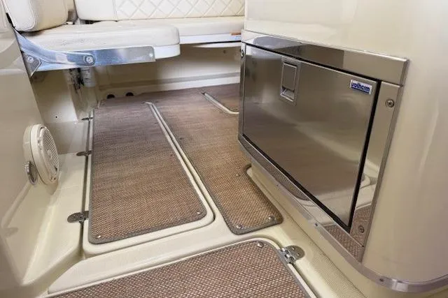 Slide: The Image of 2019 Chris-Craft Catalina 30 interior with seating and stainless steel storage. - 15