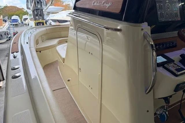 Slide: The Image of 2019 Chris-Craft Catalina 30 boat interior with seating and control panel. - 19