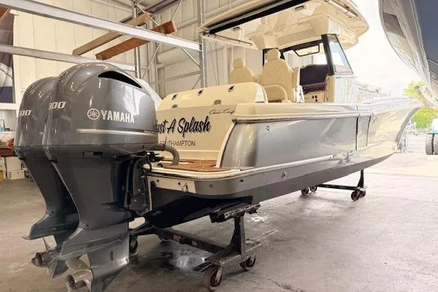 Slide: The Image of 2019 Chris-Craft Catalina 30 boat with Yamaha engines in a storage facility. - 2