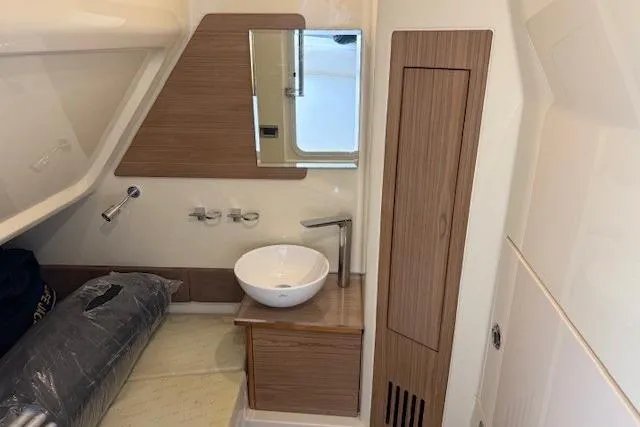 Slide: The Image of 2019 Chris-Craft Catalina 30 interior with modern sink and wooden cabinetry. - 20