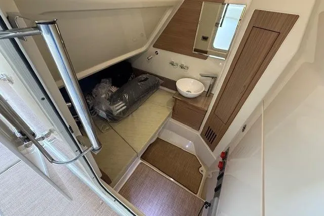 Slide: The Image of 2019 Chris-Craft Catalina 30 cabin interior with compact bathroom and modern amenities. - 21