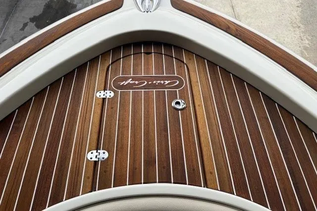 Slide: The Image of 2019 Chris-Craft Catalina 30 boat with elegant wooden deck and branded logo. - 7
