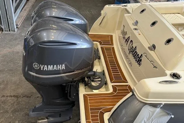 Slide: The Image of 2019 Chris-Craft Catalina 30 with twin Yamaha outboard engines, featuring teak decking. - 8