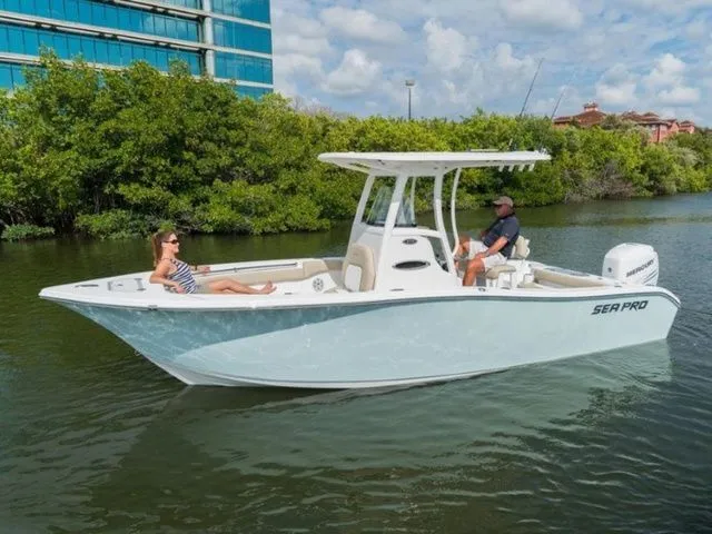 The Image of 2019 Sea Pro 239 boat on calm water with two people. - 1