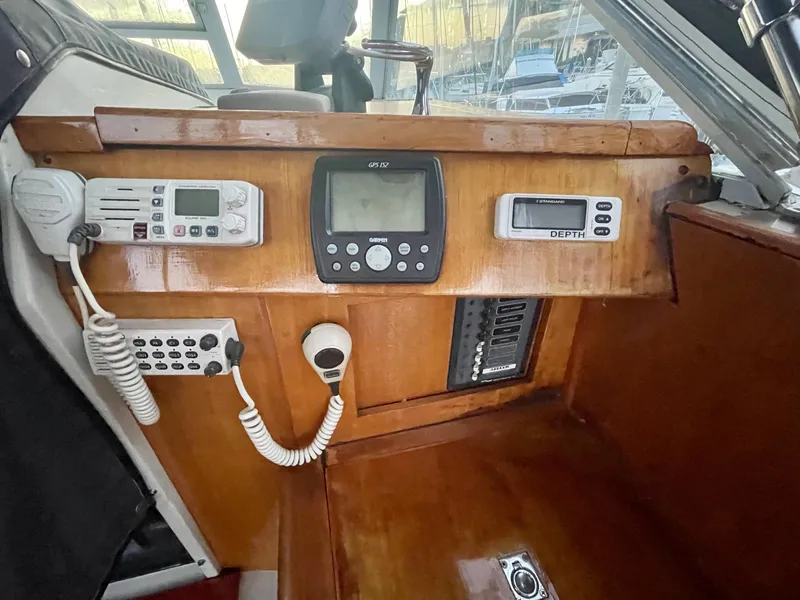 Slide: The Image of 1968 Chris-Craft Commander dashboard with navigation and communication equipment. - 14