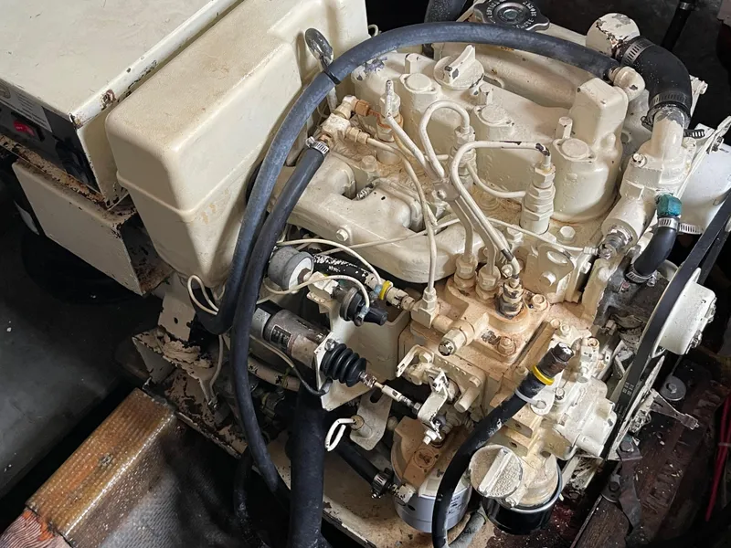 Slide: The Image of 1968 Chris-Craft Commander engine, detailed view with hoses and components. - 17