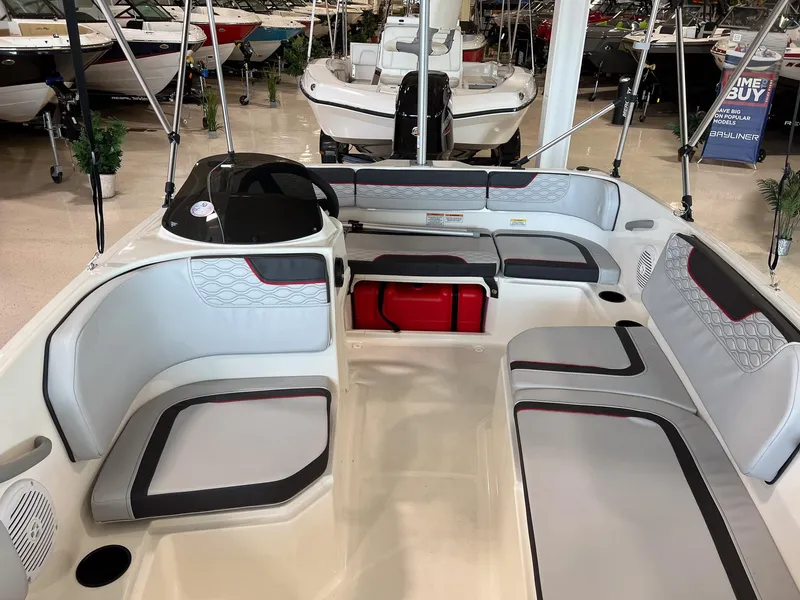 Slide: The Image of 2023 Bayliner Element M15 boat interior with seating and storage compartments. - 12