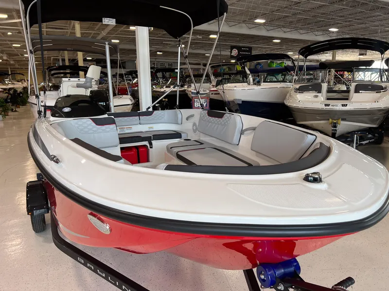 Slide: The Image of 2023 Bayliner Element M15 boat on display in a showroom. - 13