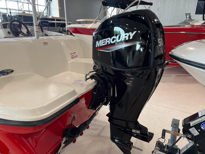 Slide: The Image of 2023 Bayliner Element M15 with Mercury outboard motor in showroom. - 15