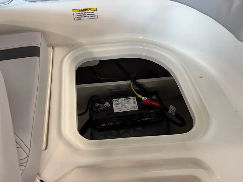 Slide: The Image of Battery compartment of 2023 Bayliner Element M15 boat. - 4