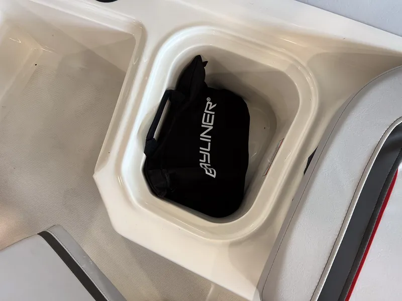 Slide: The Image of 2023 Bayliner Element M15 storage compartment with Bayliner bag. - 8