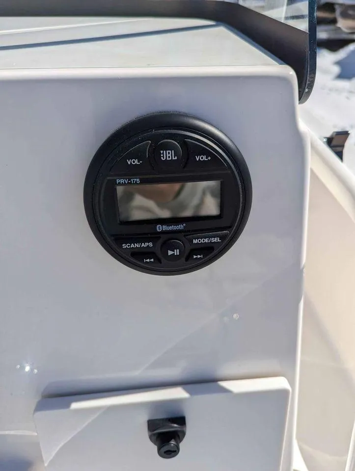 Slide: The Image of 2023 Sundance DX20 boat dashboard with JBL PRV-175 marine stereo. - 12