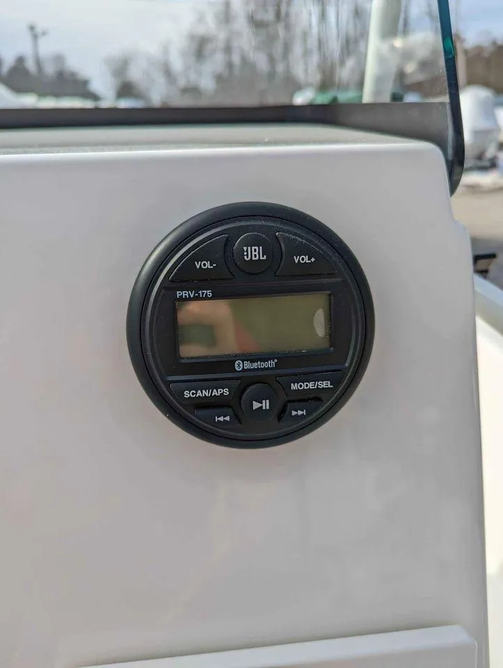 Slide: The Image of JBL Bluetooth stereo system on 2023 Sundance DX22 boat console. - 11