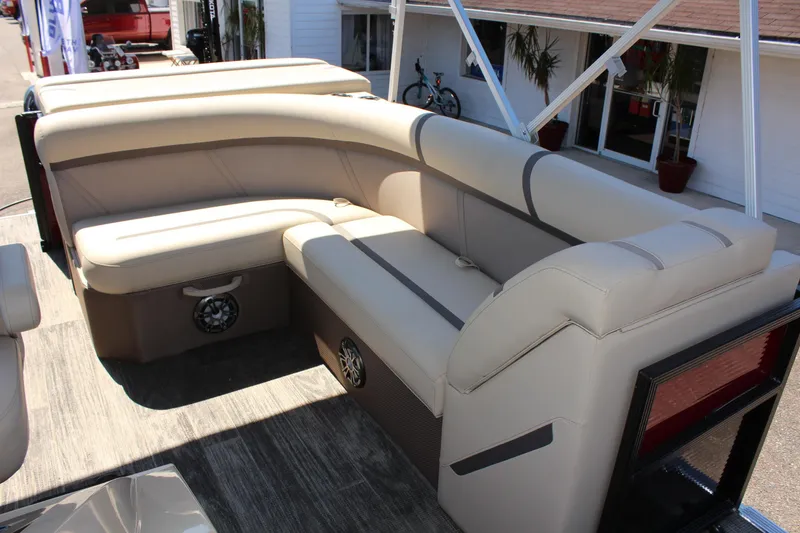 Slide: The Image of 2023 Crest Classic 200 LX L pontoon boat with beige seating. - 16