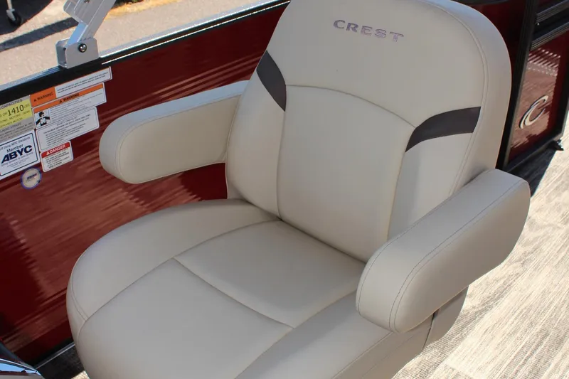 Slide: The Image of 2023 Crest Classic 200 LX L boat captain's chair in beige with armrests. - 20