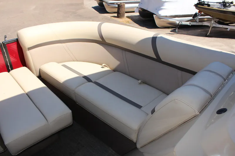 Slide: The Image of 2023 Crest Classic 200 LX L boat interior with beige seating. - 22