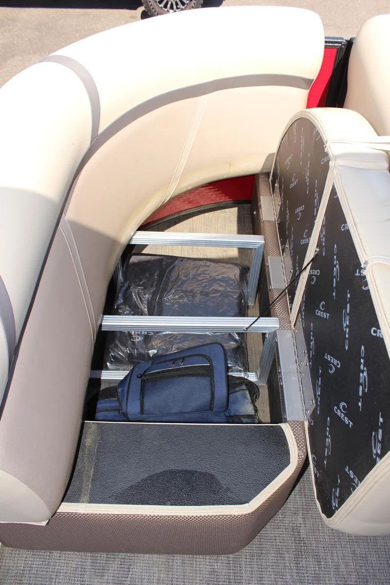 Slide: The Image of 2023 Crest Classic 200 LX L boat with under-seat storage compartment. - 24