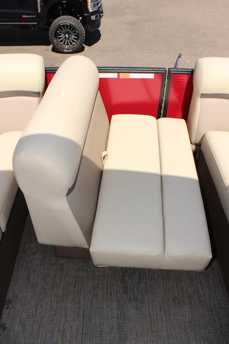 Slide: The Image of 2023 Crest Classic 200 LX L boat interior seating with beige upholstery. - 25