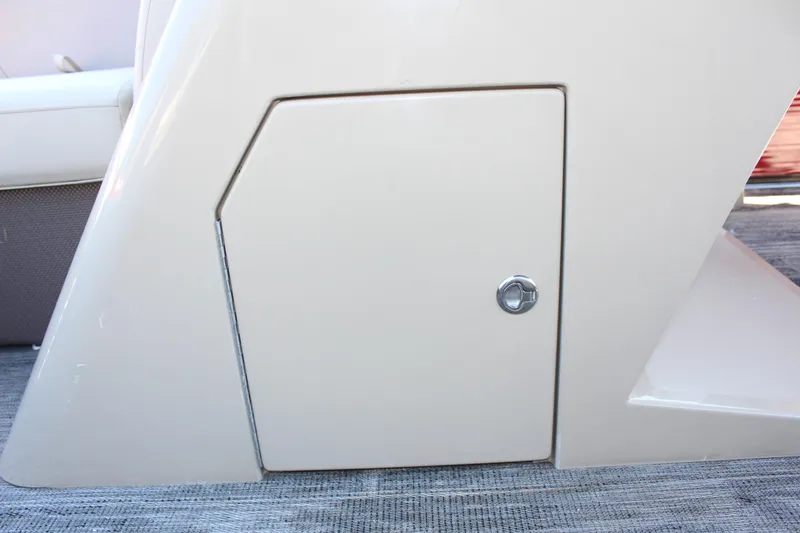 Slide: The Image of 2023 Crest Classic 200 LX L storage compartment door. - 26