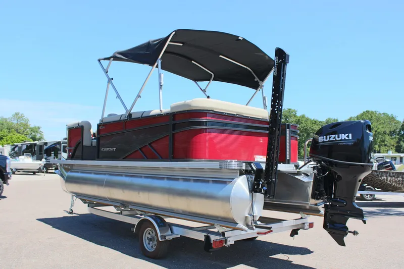 Slide: The Image of 2023 Crest Classic 200 LX L pontoon boat with Suzuki outboard motor. - 7