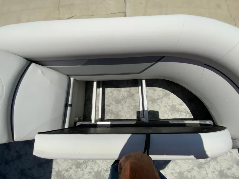 Slide: The Image of 2023 Crest Classic LX 220 SF boat interior seating and ladder. - 15