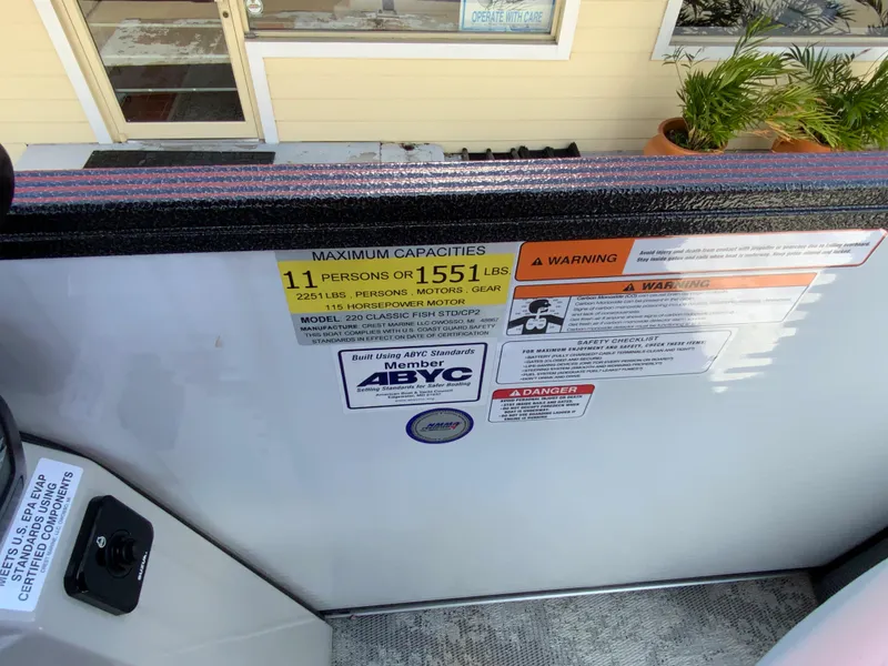 Slide: The Image of 2023 Crest Classic LX 220 SF boat capacity and safety warning labels. - 19