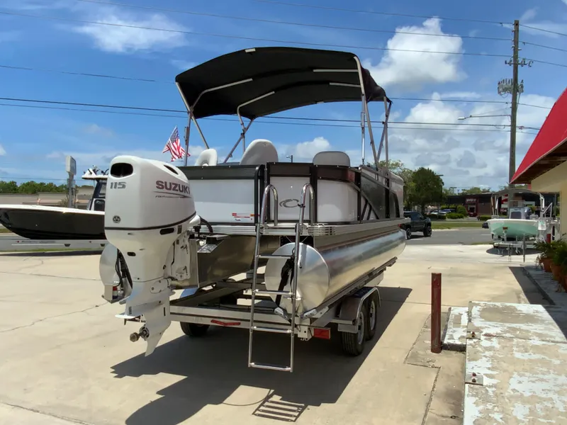 Slide: The Image of 2023 Crest Classic LX 220 SF pontoon boat with Suzuki 115 outboard motor. - 5