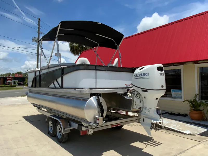 Slide: The Image of 2023 Crest Classic LX 220 SF pontoon boat with Suzuki 115 outboard motor. - 6