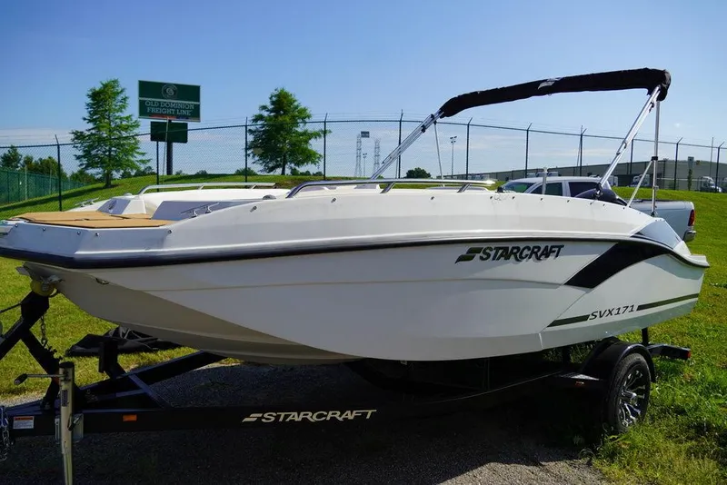 Slide: The Image of 2023 Starcraft SVX OB 171 OB boat on a trailer, side view. - 1